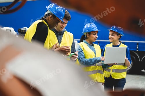 Preview: Multiethnic engineers working inside robotic factory - Focus on senior woman helmet