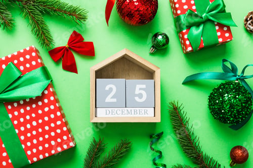 Preview: Christmas calendar 25 december. Christmas gift, fir branches, pine cones. Flat lay