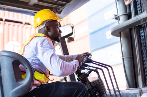 Preview: Engineer loads goods by forklift to stack containers