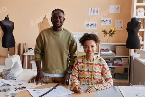 Preview: Two young African American fashion designers looking at camera with smiles