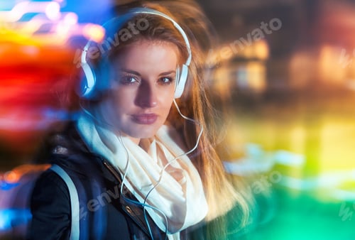 Preview: Woman in city at night among neon moving lights, fashion portrait