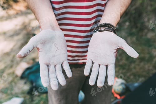 Preview: Mid section of male boulderer with white chalked hands, Lombardy, Italy