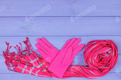Preview: Woolen gloves and shawl for woman on boards, clothing for autumn or winter, copy space for text
