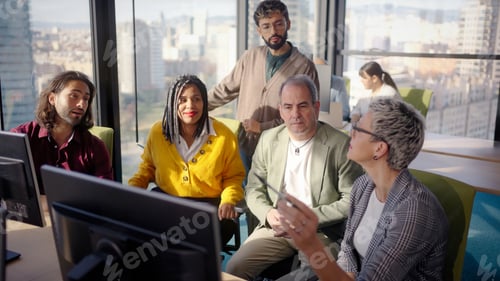 Preview: Business team analyzing data on computer in modern office
