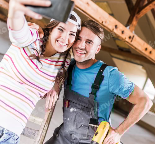 Preview: Young couple renovating their new home, taking smart phone selfies