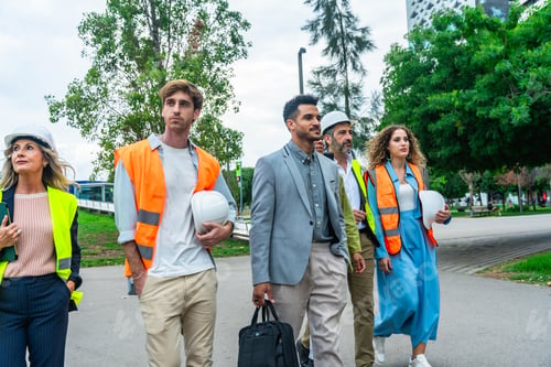 Preview: Diverse team of engineers and executives walking together