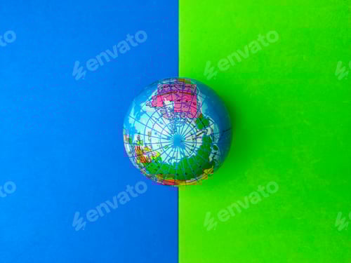Preview: Top view earth globe on a blue and green background.