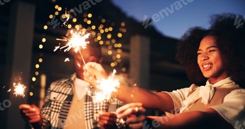 Preview: Outdoor, night and happy as couple with sparklers for new year and festive season celebration. Dark