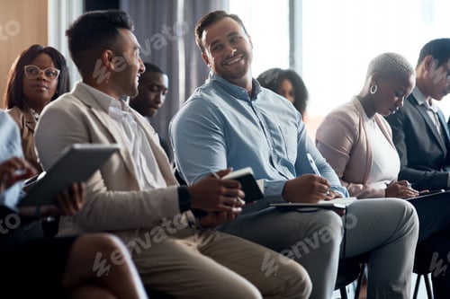 Preview: Shot of a group of businesspeople taking notes during a meeting in an office