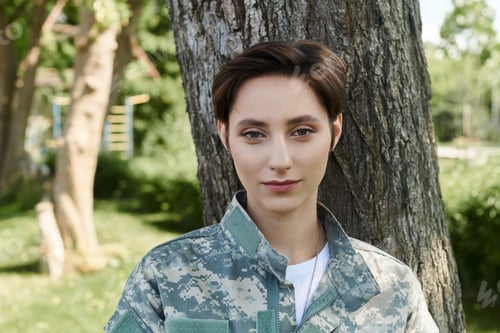 Preview: Young soldier in camouflage uniform joyfully returns home on a sunny day