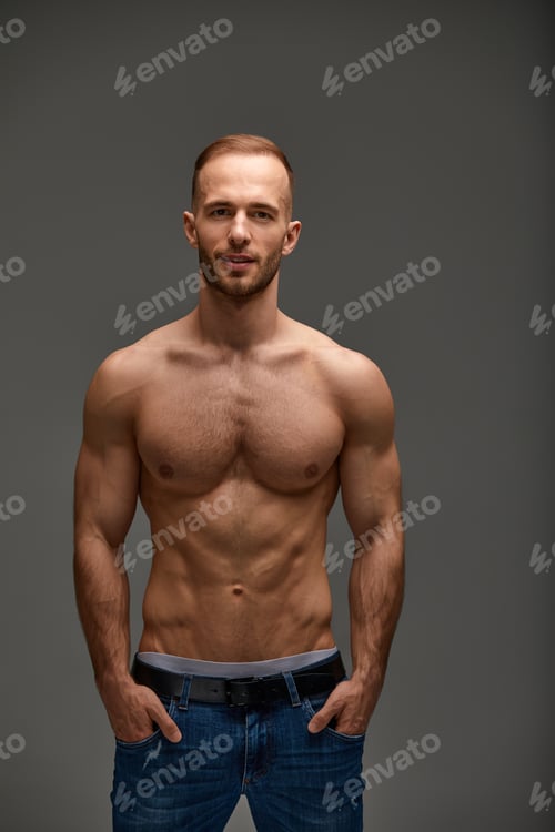 Preview: Portrait of a handsome young guy model a shirtless with a muscular healthy body, showing off his