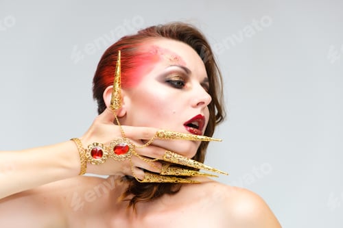 Preview: Close-Up Portrait On A White Background Of A Pretty Young Brunette Woman With Beautiful Makeup