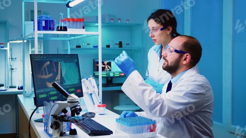 Preview: Chemist nurse holding test tubes bringing to doctor