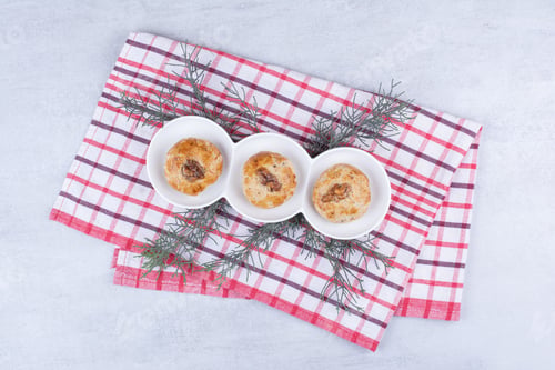 Preview: Homemade cookies with walnut kernels on tablecloth