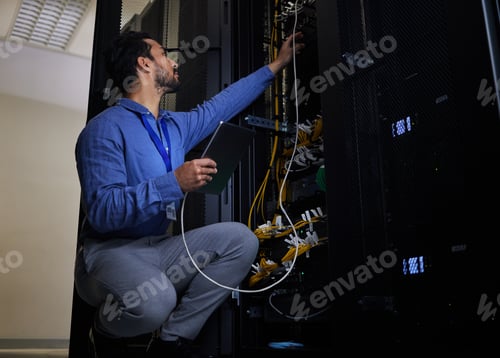 Preview: Tablet, server room and engineer with connection cable for maintenance or software update at night.