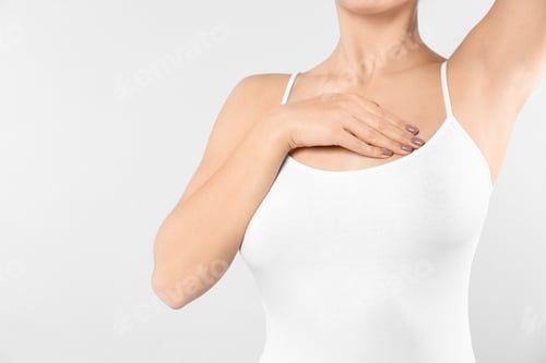Preview: Woman checking her breast on white background, closeup