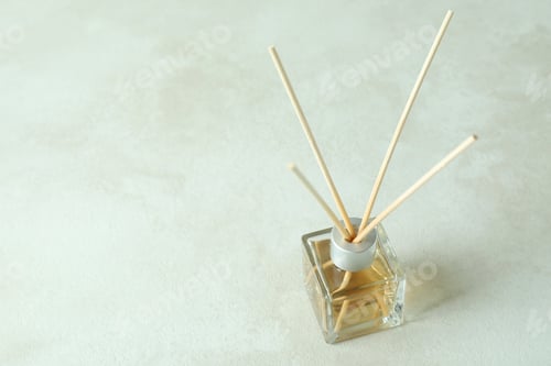 Preview: Diffuser bottle with sticks on white textured table