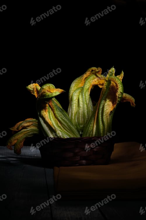 Preview: Dark Still Life of Squash Blossoms in Basket
