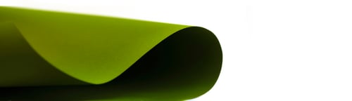 Preview: green wave from paper on white background with copy space. Top view. Close-up image. Concepts: lines