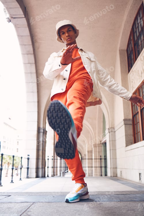 Preview: Fashion, model and gen z man from Spain with neon, trendy and luxury brand clothes. Clothing brand