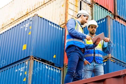 Preview: Two male engineers in a container shipping company Consulting
