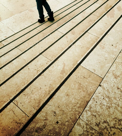 Preview: A person walking down the steps