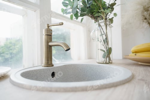 Preview: Small white kitchen sink and crane near the window