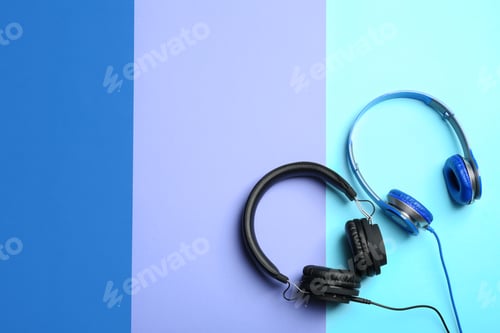 Preview: Stylish headphones on color background, flat lay. Space for text