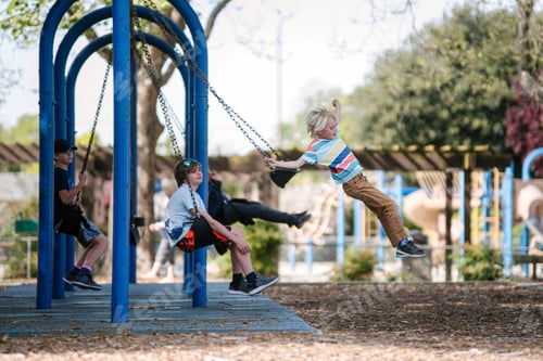 Preview: USA, California, San Francisco, Children on swings at playground
