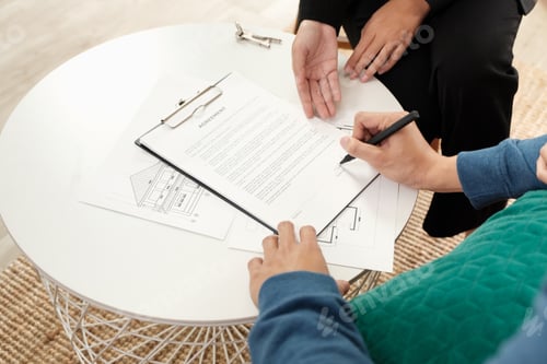 Preview: Asian couple sign home contract with realtor at home