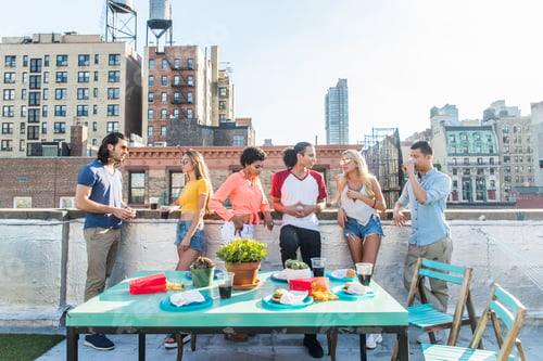 Preview: Group of friends having party on a rooftop