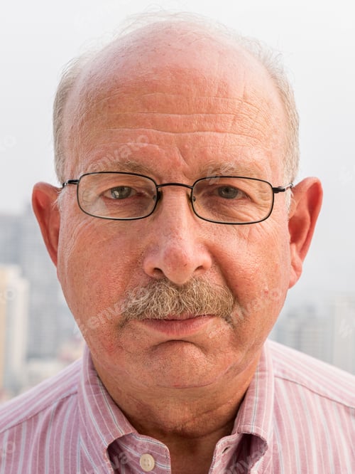 Preview: Face of senior man looking at camera close-up shot