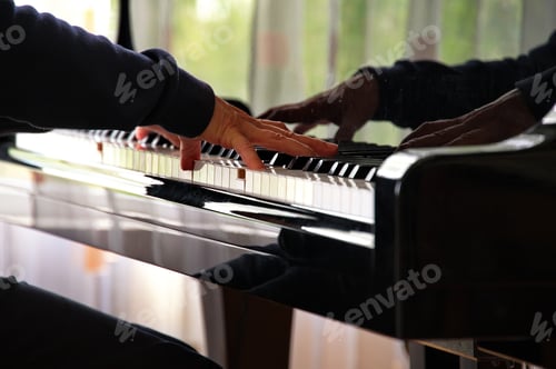 Preview: Close view of woman hand on piano keys while playing music