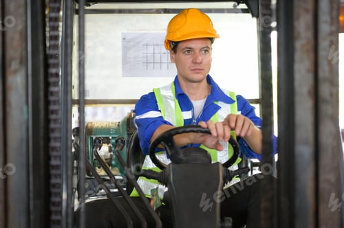 Preview: Worker in auto parts warehouse use a forklift to work to bring the box of auto parts