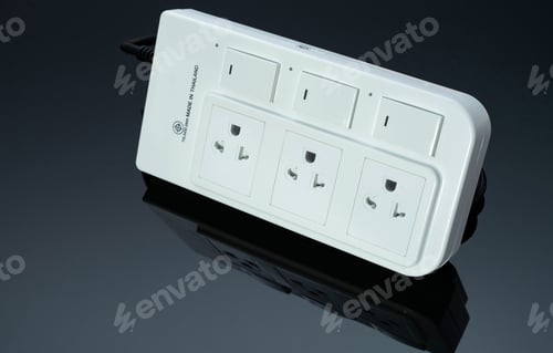Preview: Power strip with three electrical standard socket on black background. White universal plug