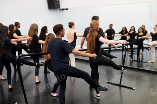 Preview: Male And Female Students At Performing Arts School Rehearsing Ballet In Dance Studio Using Barre