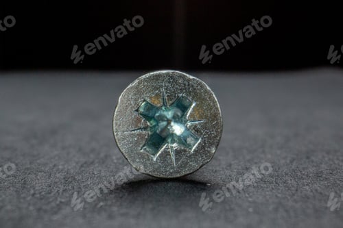 Preview: Front close view of iron tack on isolated black background with free space