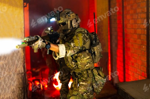 Preview: Soldier in full US MARSOC armed with assault rifle run through the abandoned building. Military