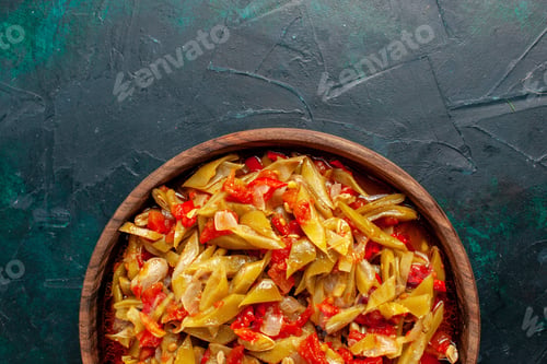 Preview: top view sliced vegetable meal cooked with different ingredients on the dark-blue desk meal food