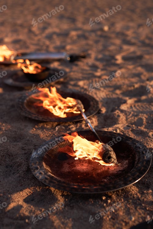 Preview: Flaming Bowls with Fire Rod on Sand Prepared for Outdoor Fire Show