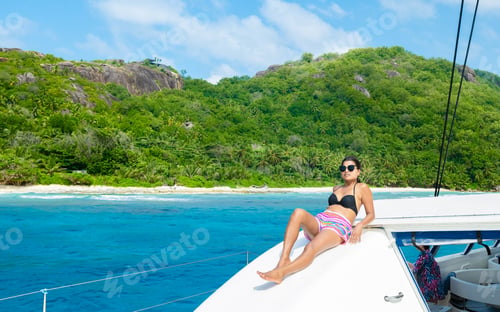 Preview: Young Asian women on a trip with a Sailing boat at the Tropical Seychelles Islands