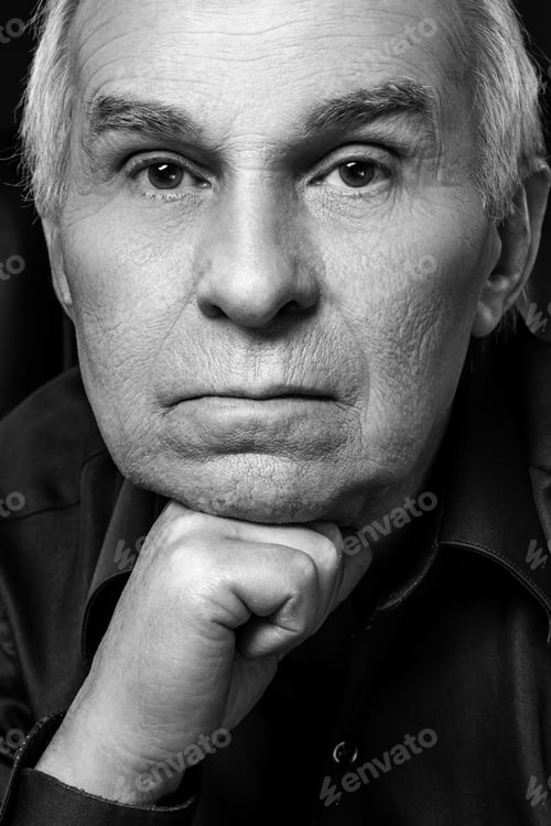 Preview: Monochrome portrait of elderly thoughtful man in studio