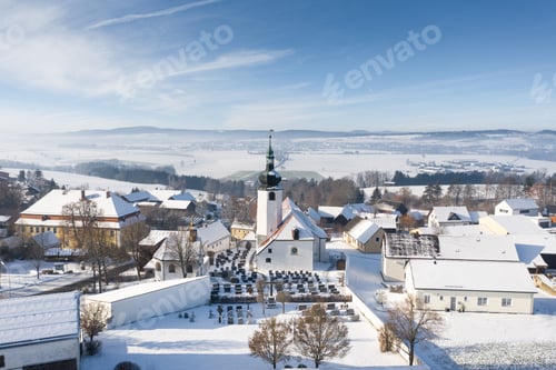 Preview: Aerial view of snow-covered Rooftops of a town in winter in Mitterteich