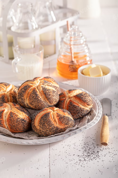Preview: Healthy Kaiser buns with poppy seed baked for golden brown.