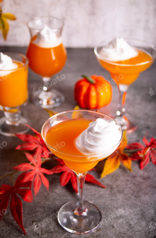 Preview: Pumpkin fall seasonal drink cocktail latte with spices and whipped cream for Thanksgiving