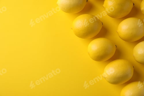Preview: Ripe lemon fruits on yellow background, flat lay. Space for text