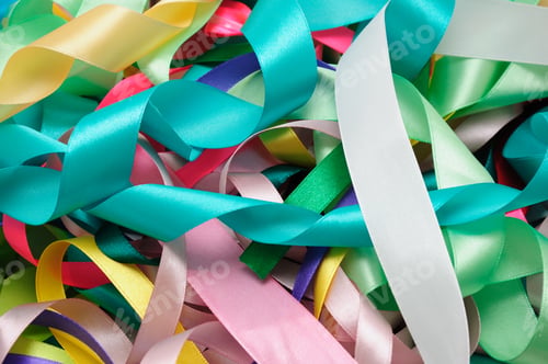 Preview: Multi-colored satin ribbons in a chaotic manner closeup