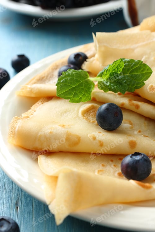 Preview: Homemade crepes with blueberries, chocolate sauce