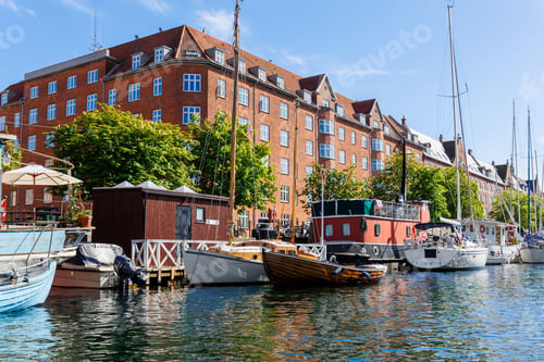 Preview: Scenic view Christianshavn Copenhagen canal marina embankment with many boats vessel yachts moored