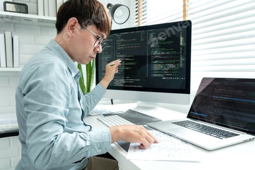 Preview: Male programmer is programming to develop program app and website of corporate while working